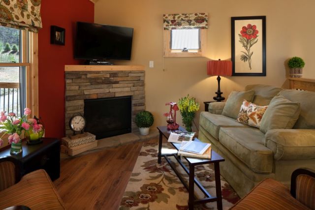 Inviting living room with very large deck to enjoy nature.