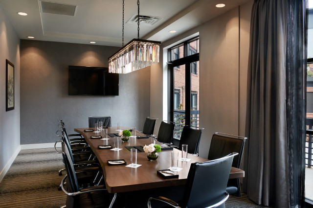 Executive style boardroom with natural light and built in audio visual