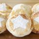 six mince pies are displayed with a white star sprinkled on each