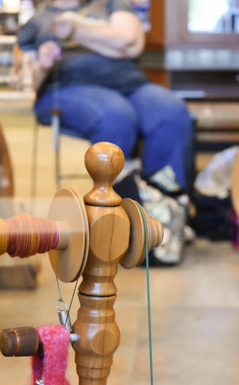 Wood equipment to spin yarn in a fiber arts workshop in Asheville