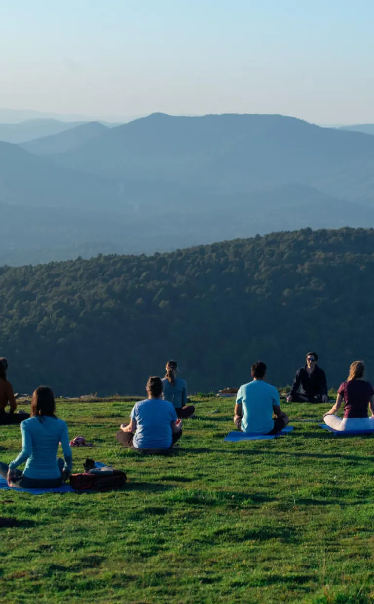 People doing mountaintop yoga on Bearwallow Mountain / Photo: Stephan Pruitt