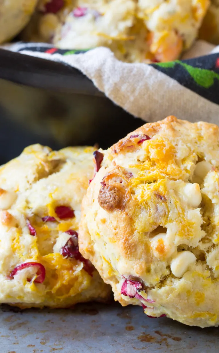 Two cranberry walnut scones on a table