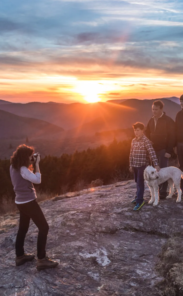 Family hiking with mountain views