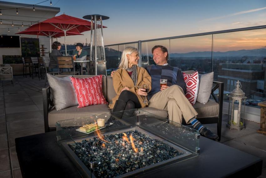 Couple at Pillar Rooftop Bar Fire Pit / Photo: Emily Chaplin