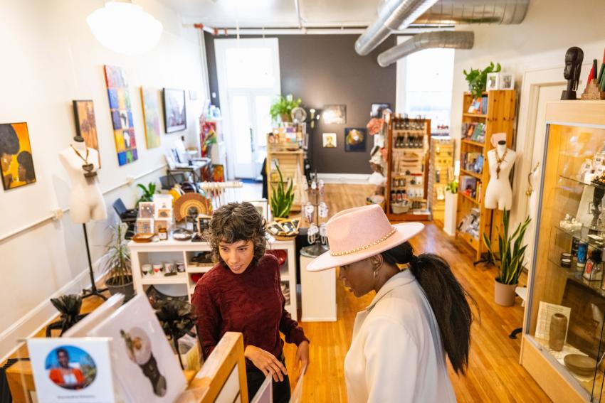 Women shopping Downtown looking at pottery Women shopping Downtown looking at pottery