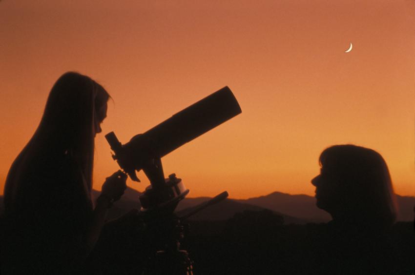 Girl Looking through Telescope Girl Looking through Telescope